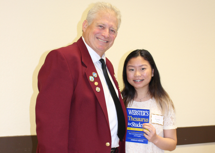 Left to right are Gary Grayson, Exalted ruler - Elks Lodge #6, Jazmin Lor, Capital City High School